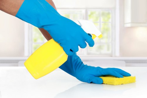 Carpet cleaning staff preparing equipment in a safe working environment