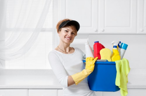 Cleaning technician using protective gear during carpet cleaning