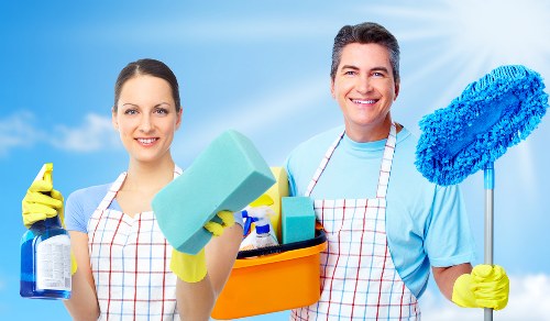 Cleaner wearing protective gloves and footwear during service